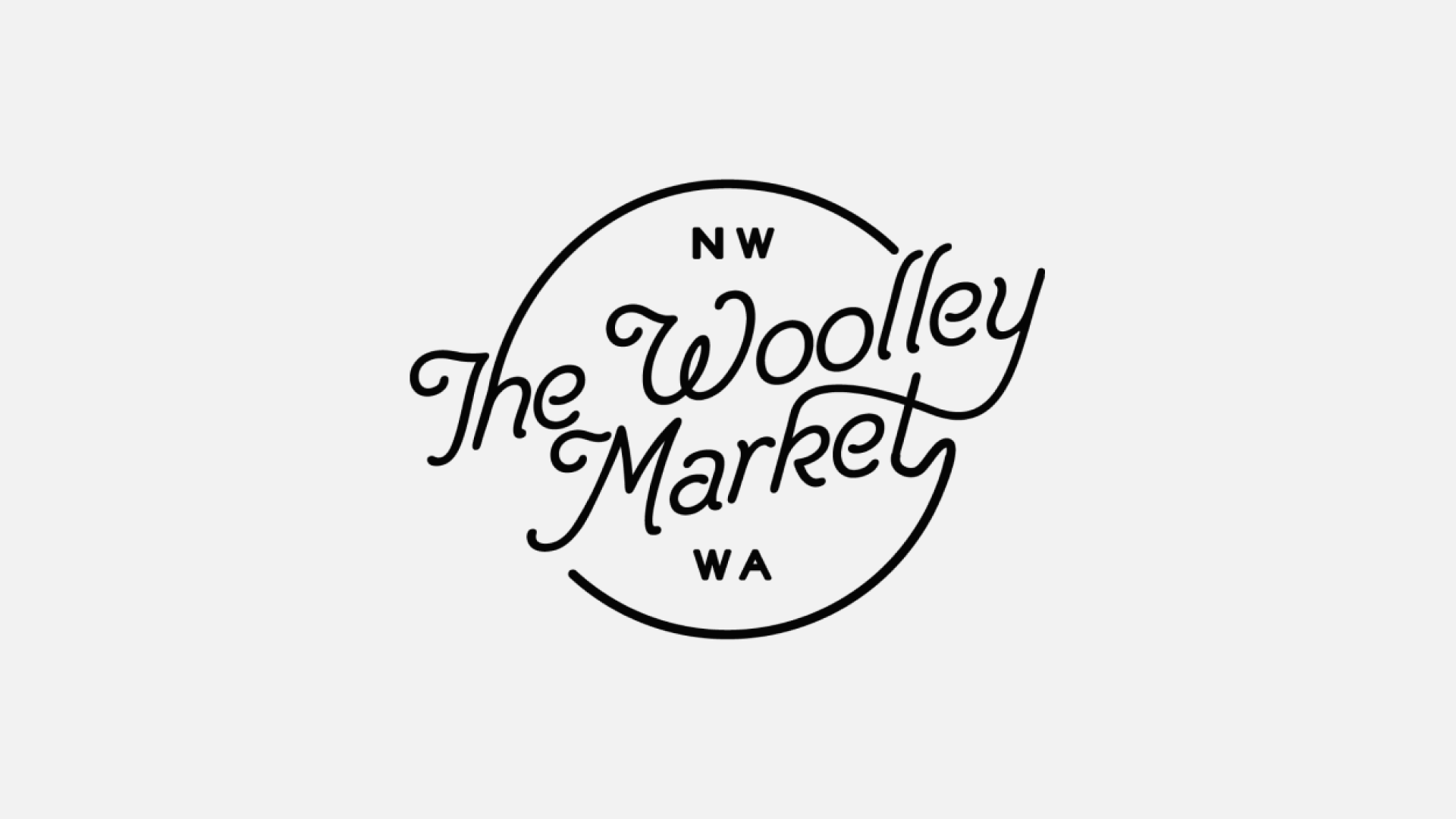 Circular script arrangement of the words The Woolley Market with initials signifying nw wa for Northwest Washington